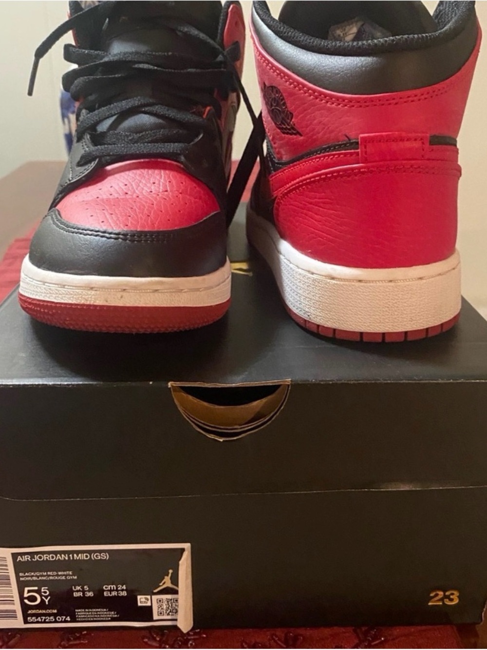 Air Jordan 1 Mid ‘Banned’ Sneakers in Red and Black